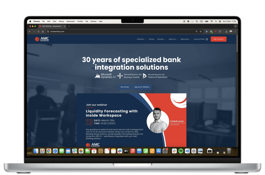 AMC Consult homepage on a laptop screen
